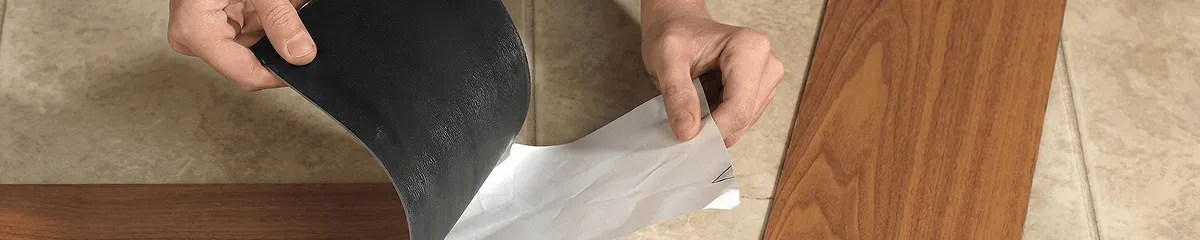 A professional installing vinyl flooring in Tucson, AZ